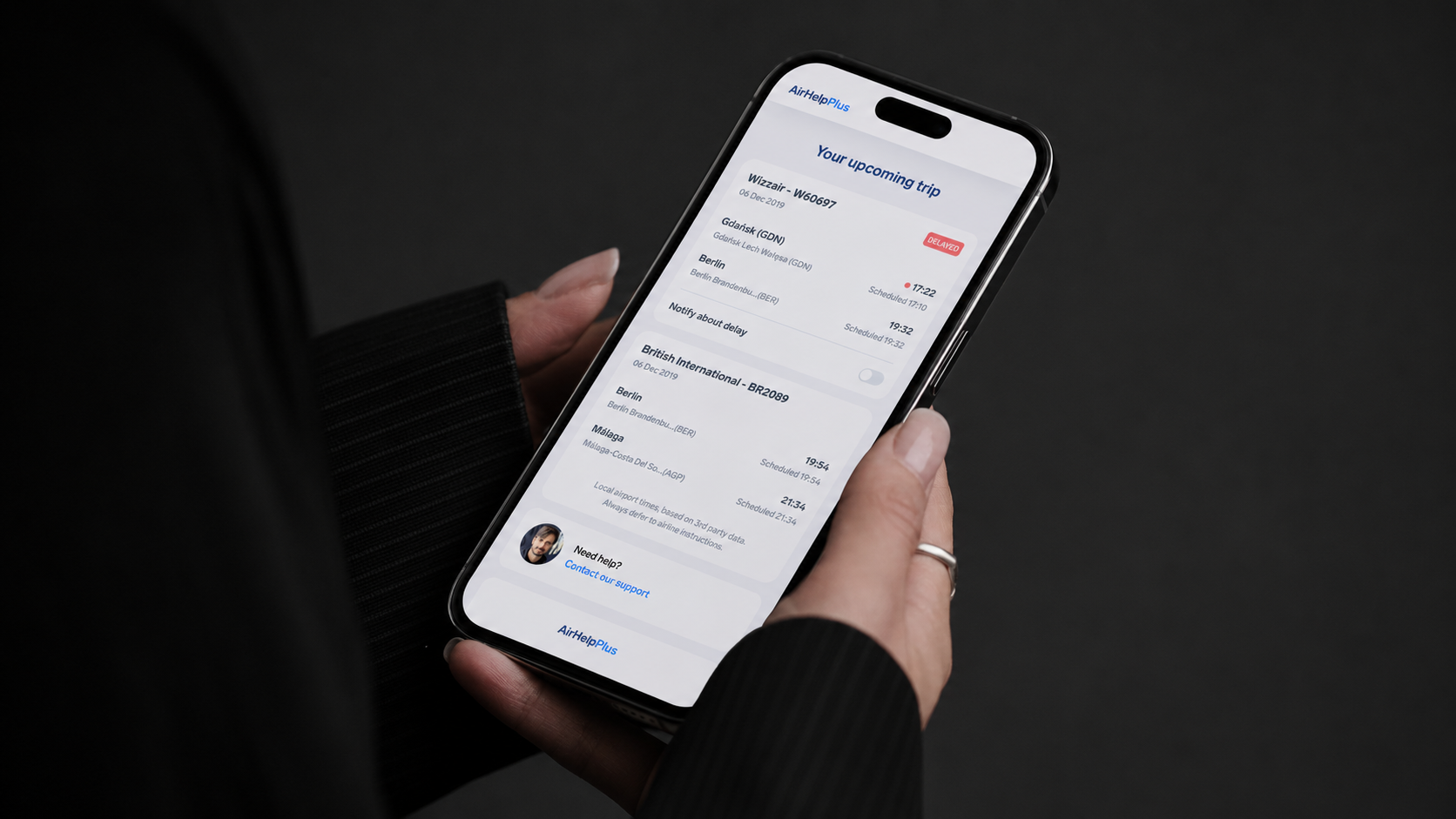 AirHelp Plus app in hand